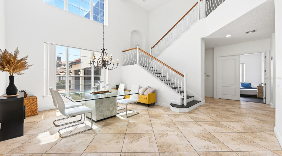 Nearby, the formal Dining Room is framed by large windows that fill the room with NATURAL LIGHT and provide lovely views of the front landscape.