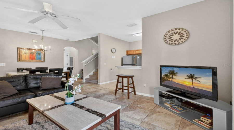 Living room featuring an open view into the dining room.