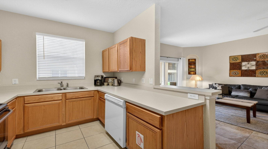Fully equipped kitchen with an open view into the family room.