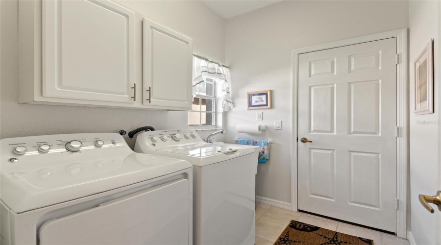 Utility sink in corridor laundry room