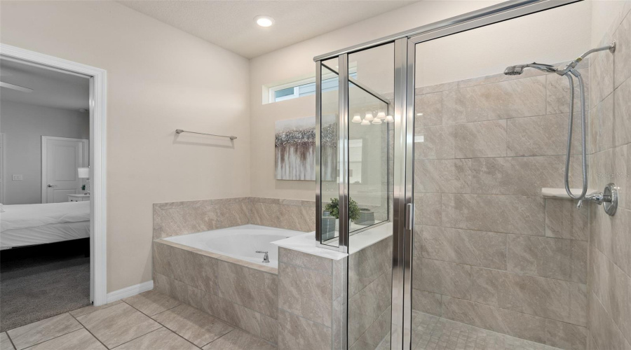 bathroom 1 attached to bedroom 1 and door to pool area