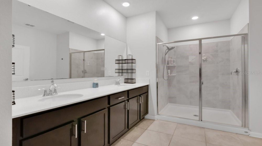 Primary Full Bathroom with a double vanity.