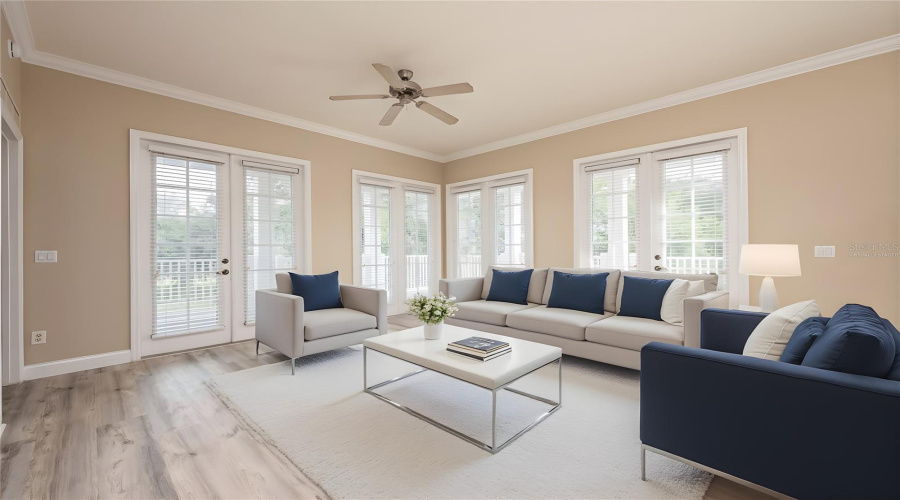 Natural light pours in through four sets of French doors. Virtually Staged.
