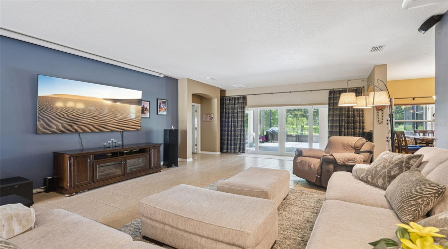 Living Room showing Screen projector above the TV