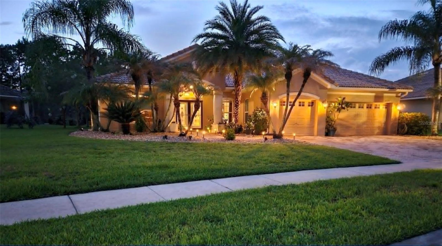 Front of the house at night.