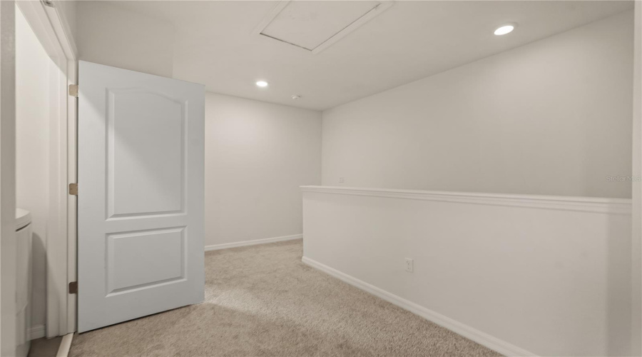 Loft landing with view to laundry closet