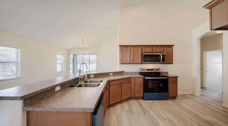 Kitchen features large breakfast bar and separate eat-in dining space