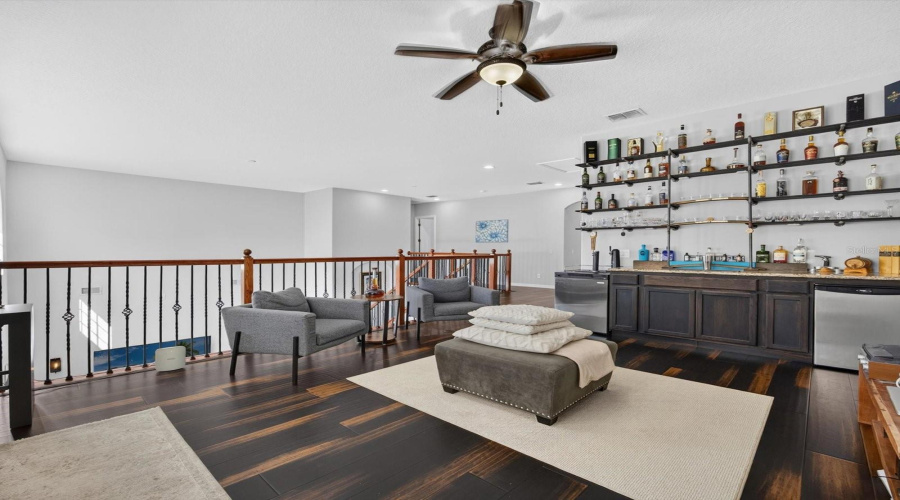 Loft with bamboo flooring and Upstairs wet bar