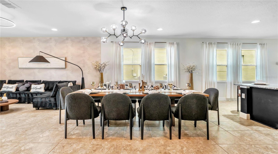 Gather everyone together around the spacious dining table with additional seating nearby—perfect for celebrating birthdays, holidays, or unforgettable family vacations.