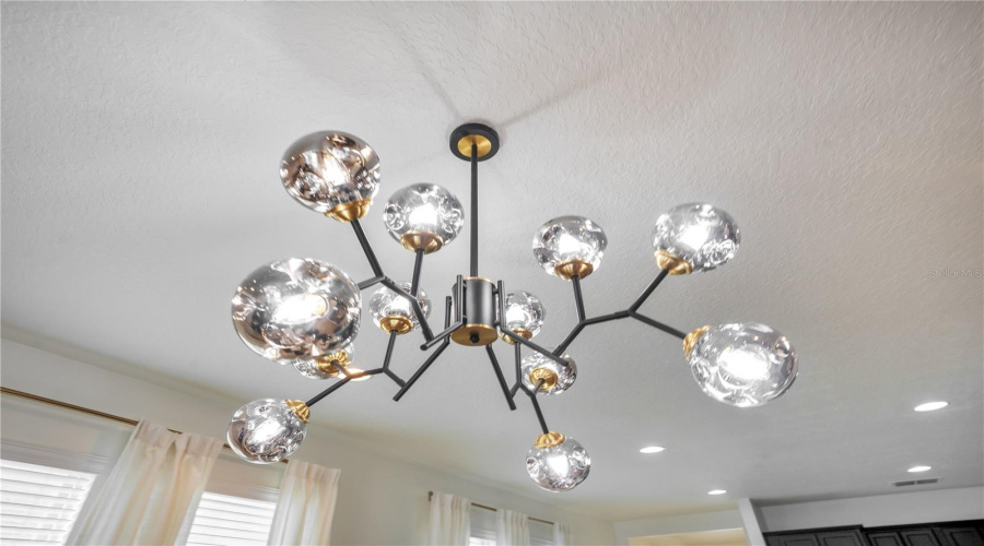 Designer lighting and updated finishes throughout reflect the extensive renovations that transformed this home into The WonderHouse.