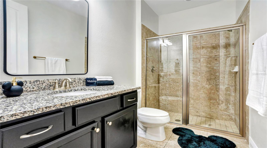 The spacious primary ensuite features dual vanities, generous storage, and a large walk-in shower for added comfort and convenience.