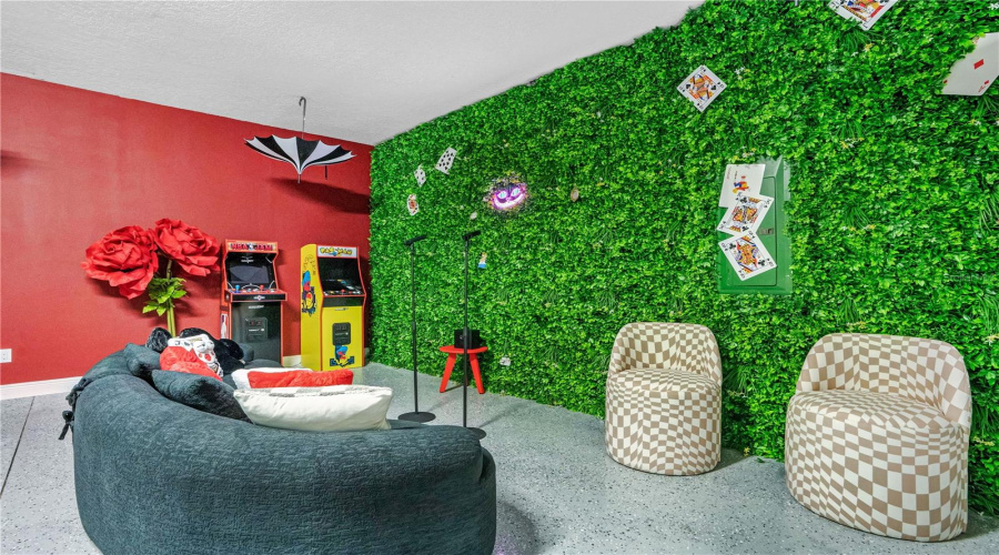 Every corner of the Wonderland game room invites guests to relax, play, and discover another unexpected detail.