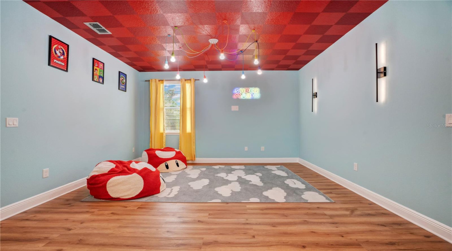 Bright colors, playful details, and generous space create the perfect hangout for kids and gamers of every age.