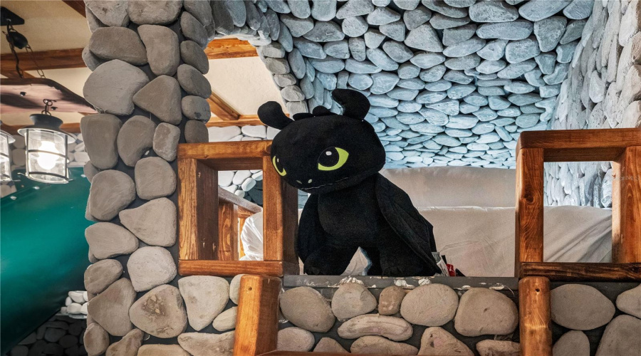 Toothless keeps watch from above as handcrafted details transform this room into an unforgettable fantasy hideaway.