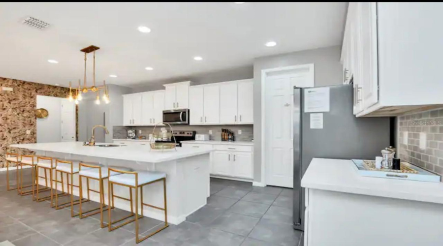 KISSIMMEE, Florida 34747, 6 Bedrooms Bedrooms, ,5 BathroomsBathrooms,Residential,For Sale,SAWYER PALM,0,MFRO6381814
