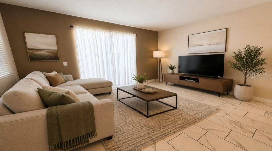 Virtually staged living room highlighting a bright, inviting space with comfortable seating, neutral finishes, and a relaxed vacation-home feel.