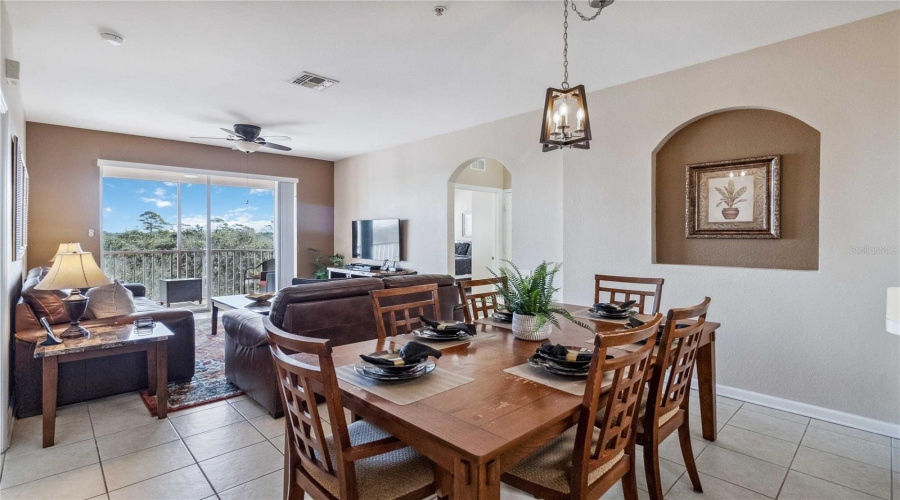 Open floor plan showing dining, living and balcony.