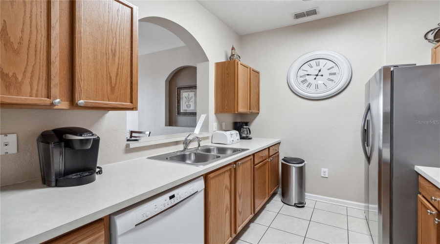 Another view of kitchen showing opening wall to dining area.