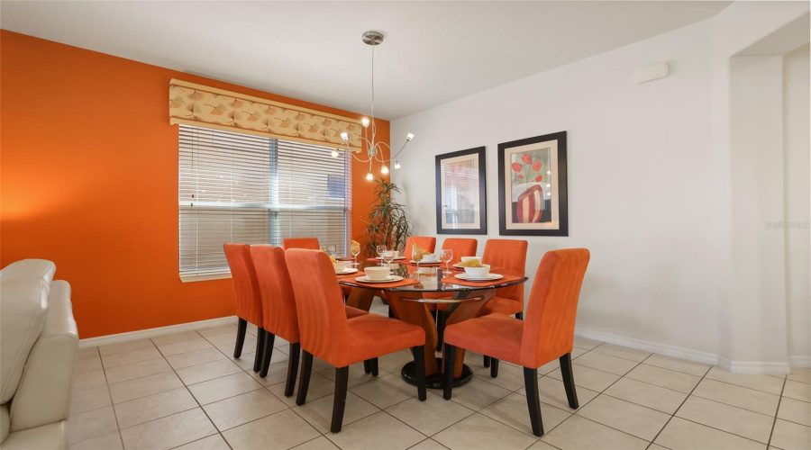 Formal dining area conveniently positioned adjacent to the living room, ideal for family meals and entertaining guests.