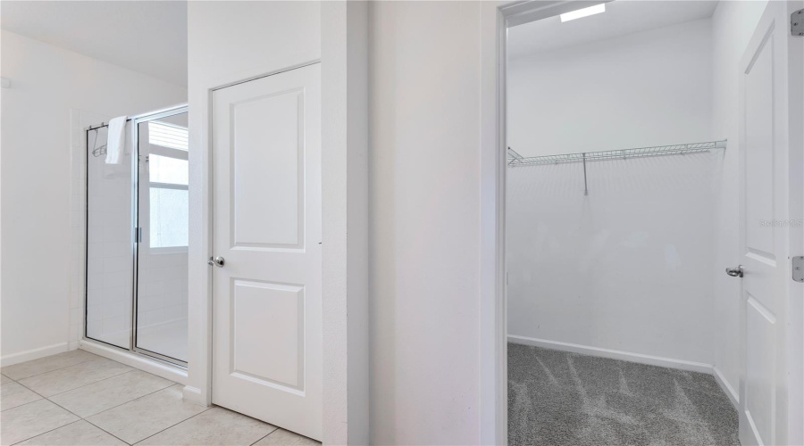 First floor primary ensuite with walk-in closet.