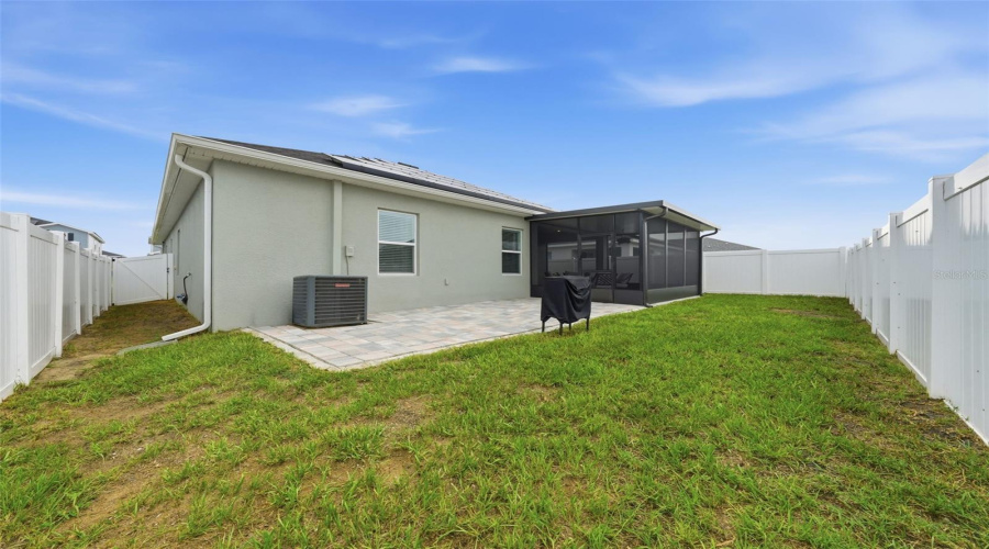 Fenced Backyard With Extended Pavers