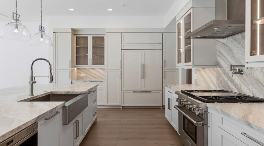 Gourmet kitchen with frameless contemporary cabinetry and alarge prep island