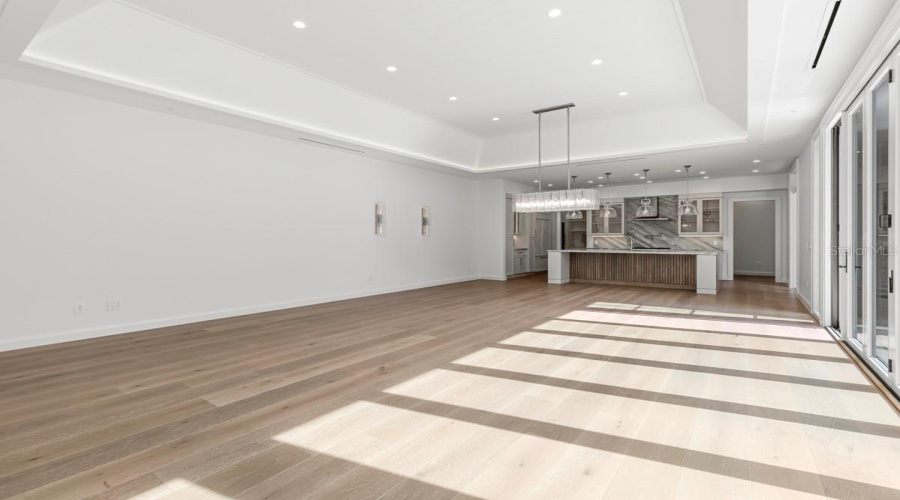 Open concept living space with dining and gourmet kitchen