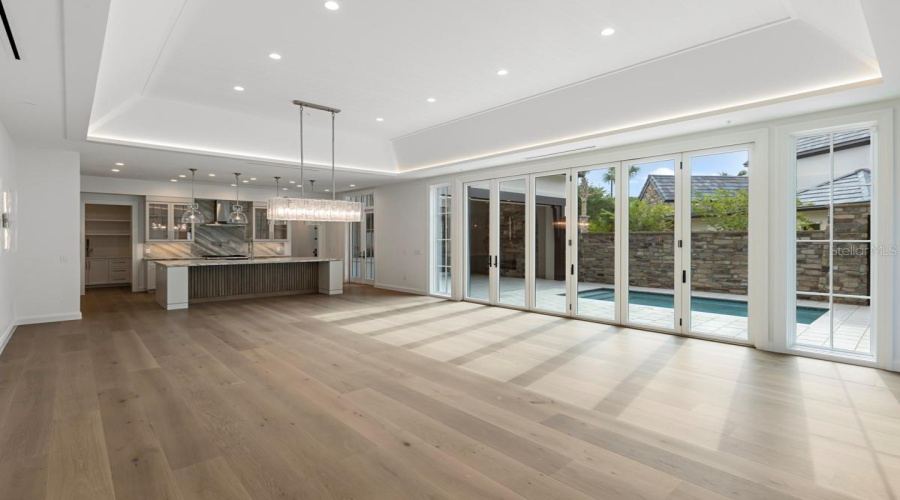 Open concept living space with dining and gourmet kitchen