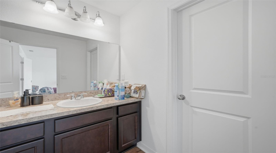 Upstairs full bath #1. Seller in process of packing up. This is a short sale.