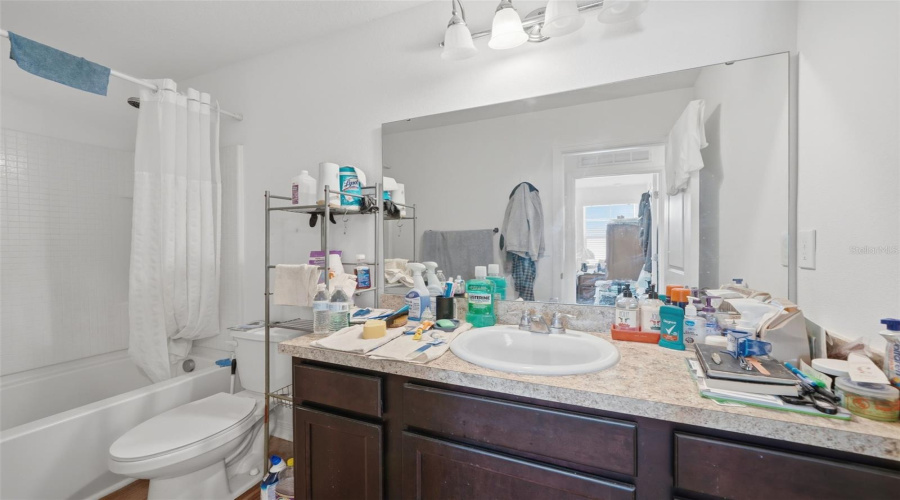 Upstairs full bathroom #2. Seller in process of packing up. This is a short sale.