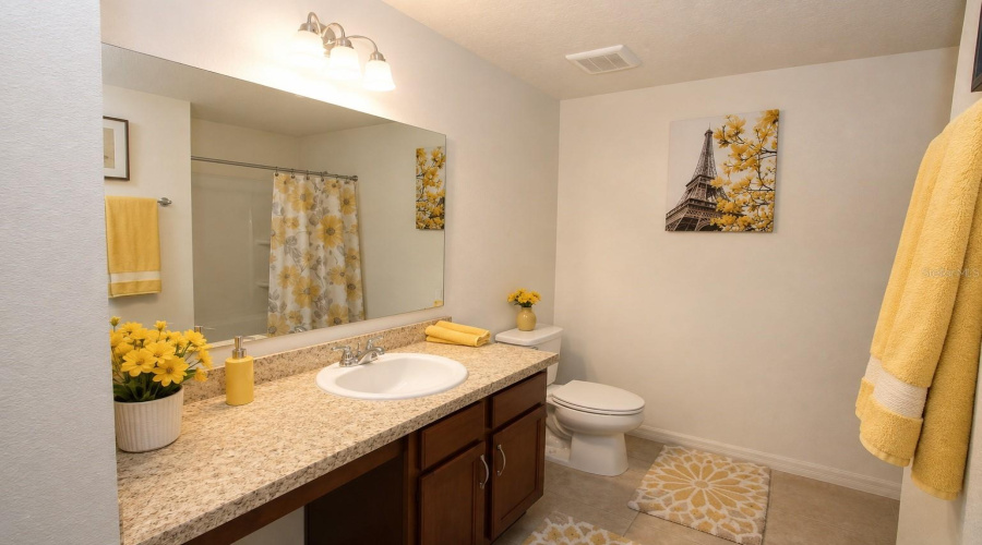Spacious upstairs family bathroom complete with a bathtub and shower combination.