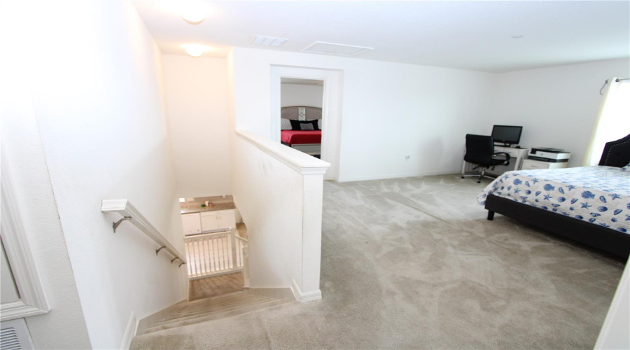 Spacious second-floor bonus area, perfect for a home office, media room, playroom, or additional living space.