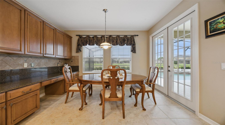 Chef's kitchen with extended wall of cabinets and counters