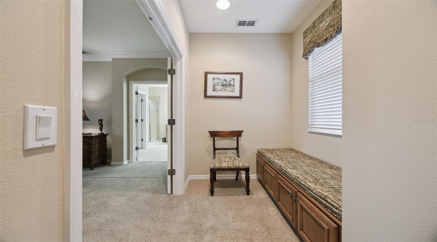 Seating with storage outside the primary bedroom