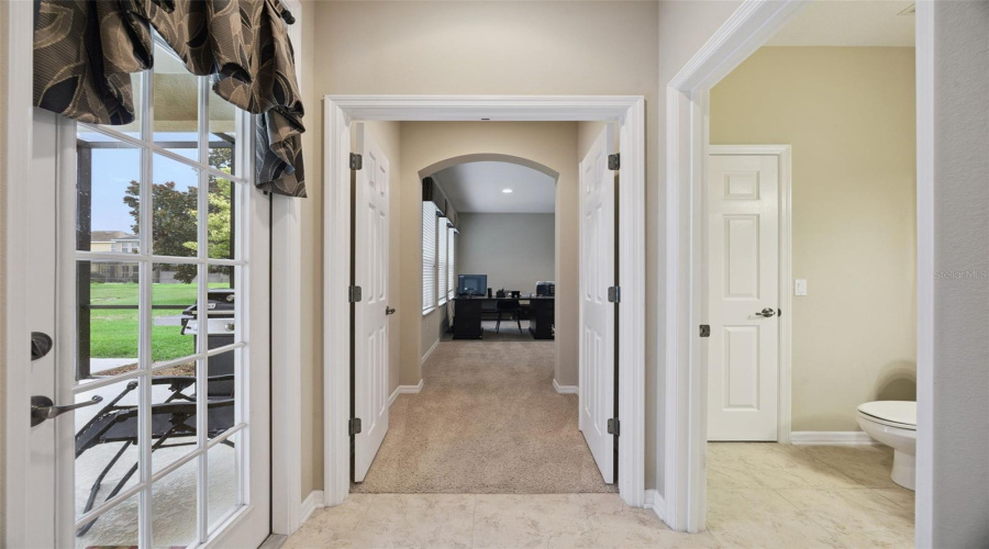 Entry through double doors to first level bedroom / office