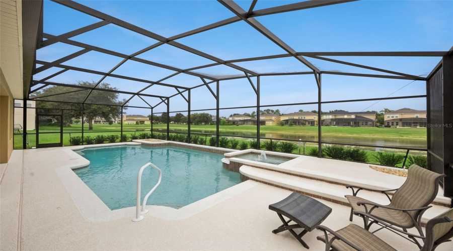 Large pool and spa overlooking the pond