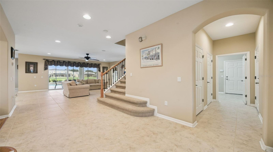 To the right is under stair storage, laundry room, and access to two separate garages