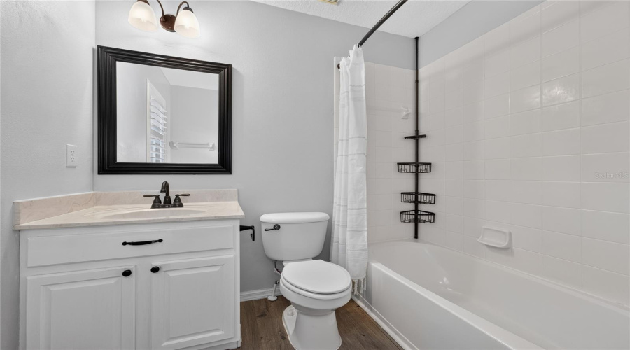 Seconday En-Suite Bathroom with shower tub combo