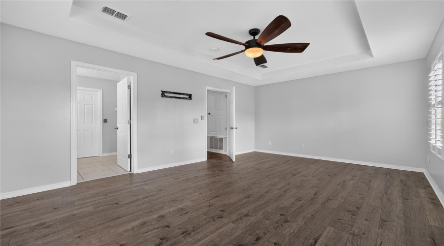Primary Bedroom with Laminate Floors