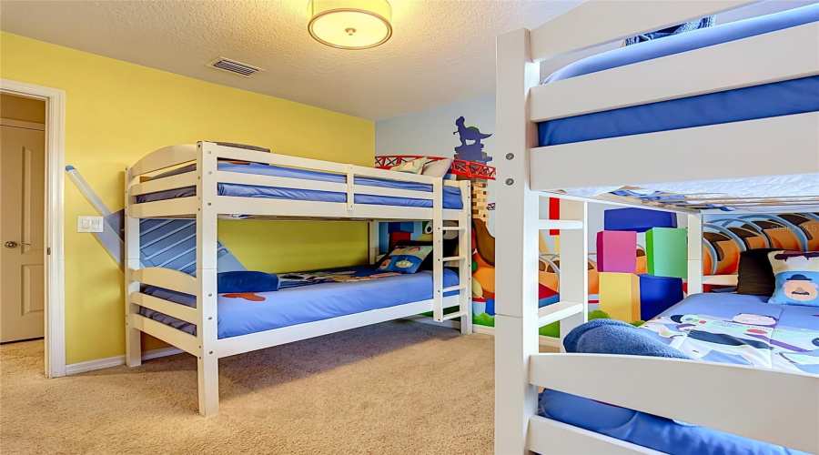 Custom-themed bunk room with hand-painted mural & twin-over-full bunk beds