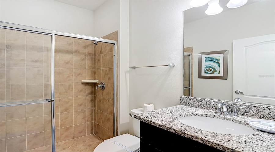 Downstairs full bathroom with granite vanity & walk-in shower