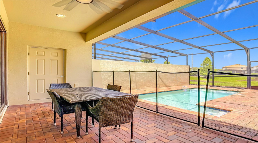 Screened-in lanai overlooking the private pool & pond