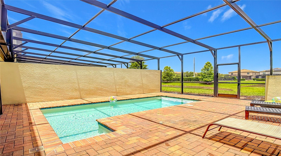 Private screened-in pool with peaceful pond views