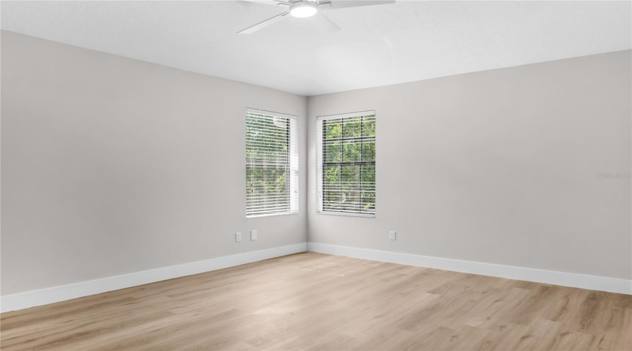 Second Primary Bedroom located on second floor features LVP flooring, walk-in closet and ensuite bath