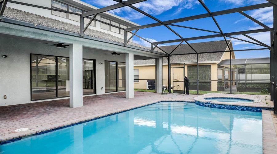 Newly resurfaced Screen enclosed pool and spa and spacious covered lanai