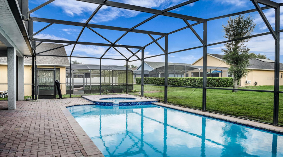 Newly resurfaced Screen enclosed pool and spa and spacious covered lanai