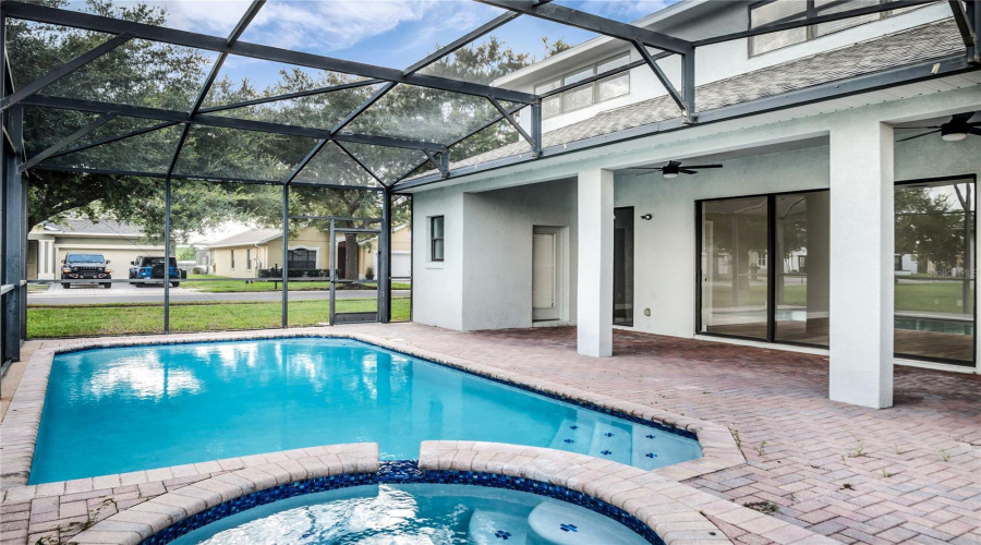 Newly resurfaced Screen enclosed pool and spa and spacious covered lanai
