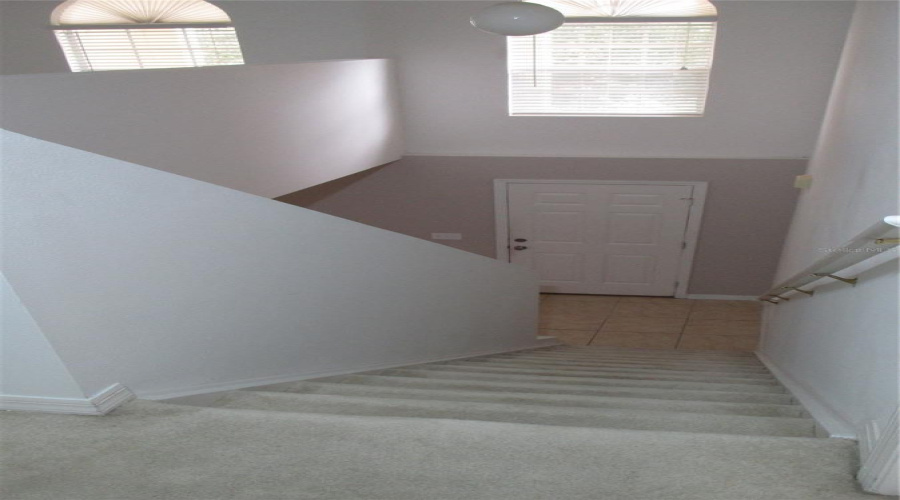 View from upstairs to front entrance of home