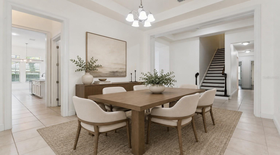 A formal dining area that opens conveniently into the kitchen, creating an easy flow for dining and entertaining.