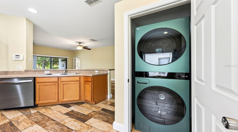 The NEW WASHER AND DRYER (2023) are conveniently tucked away in a Kitchen closet, making laundry day a breeze.